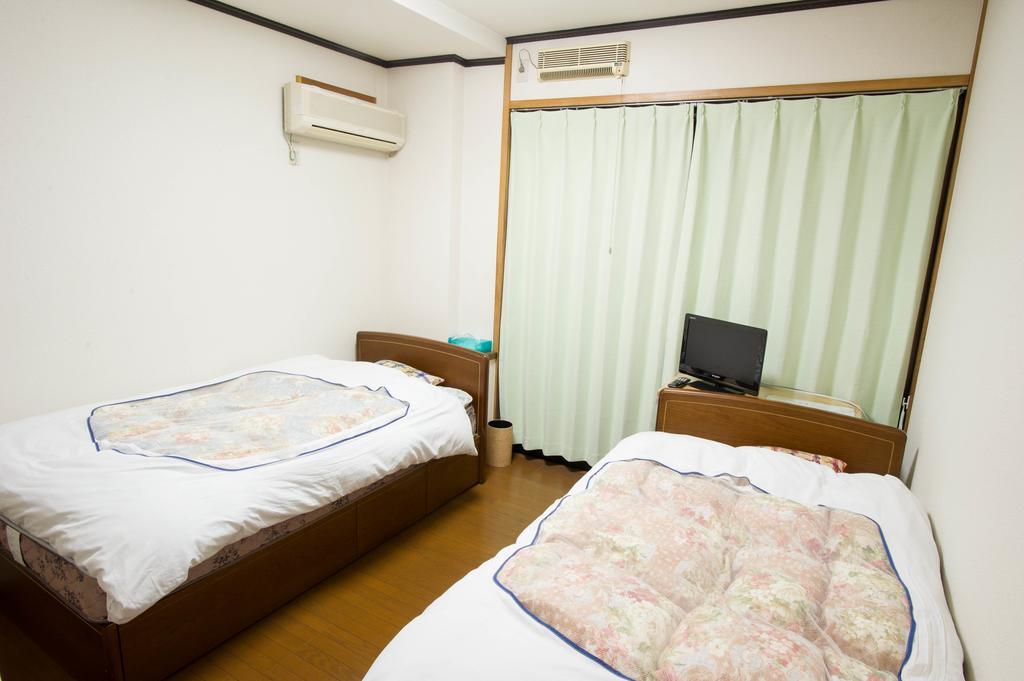 Hotel 駅前山小屋a-Yard à Ome Chambre photo